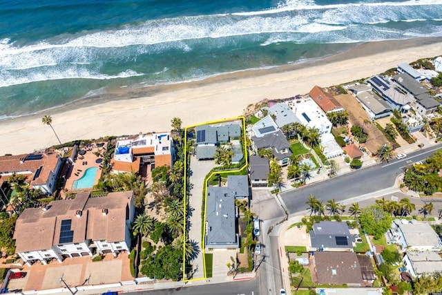 aerial view featuring a beach view, a residential view, and a water view