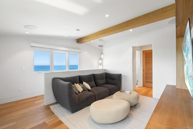 living area featuring recessed lighting, baseboards, lofted ceiling with beams, and light wood finished floors