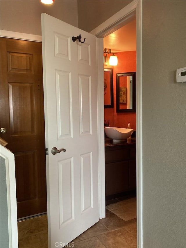 3800 Stocker St Unit 17, View Park, CA 90008 - hallway featuring a sink and dark tile patterned floors