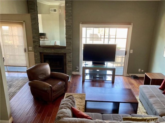 3800 Stocker St Unit 17, View Park, CA 90008 - living room with wood-type flooring, a large fireplace, and baseboards