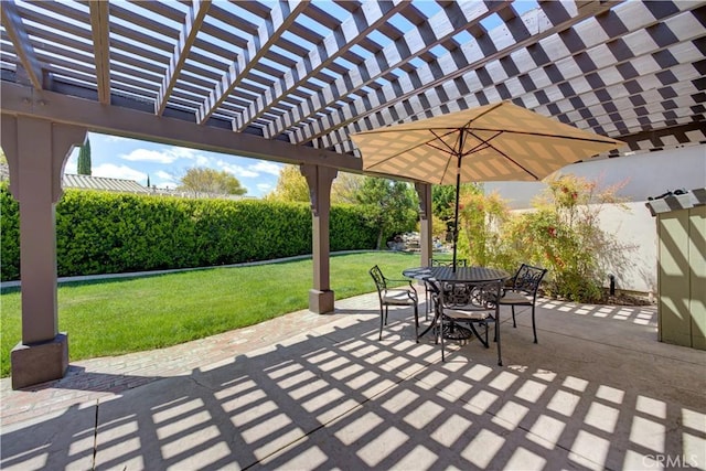 view of patio featuring a pergola and outdoor dining space