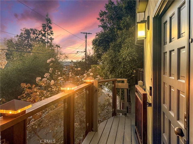 view of balcony at dusk