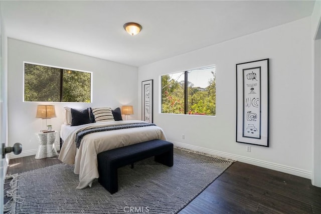 3392 Coy Dr, Sherman Oaks, CA 91423 - bedroom with multiple windows, baseboards, and wood finished floors