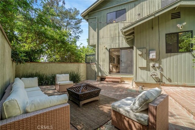 3392 Coy Dr, Sherman Oaks, CA 91423 - view of patio / terrace with an outdoor living space with a fire pit
