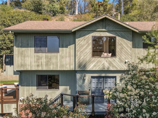 view of front of house featuring roof with shingles