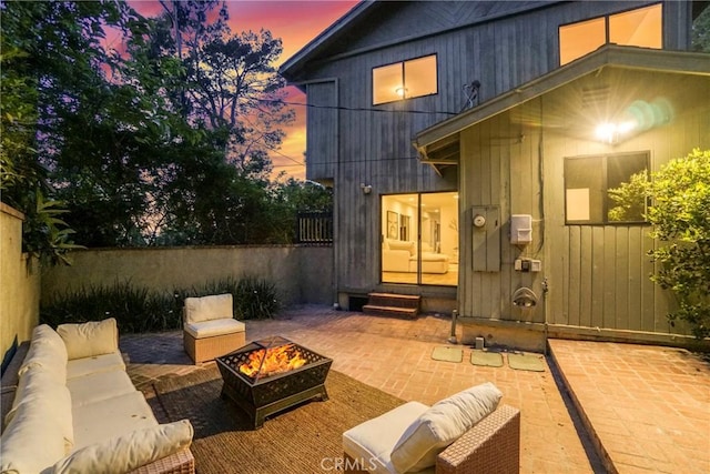 3392 Coy Dr, Sherman Oaks, CA 91423 - patio terrace at dusk with entry steps, a patio area, and an outdoor living space with a fire pit