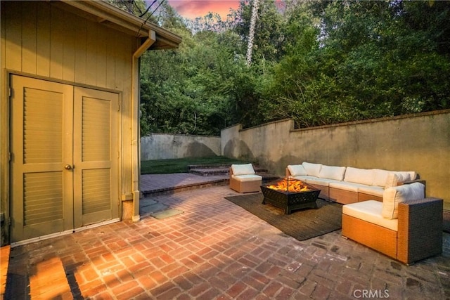 3392 Coy Dr, Sherman Oaks, CA 91423 - patio terrace at dusk with a fire pit and a patio area