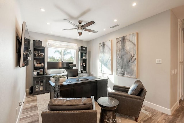 home office with a ceiling fan, baseboards, recessed lighting, light wood-type flooring, and visible vents
