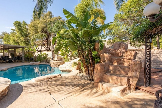 view of pool featuring a fenced in pool, a fenced backyard, and a patio area