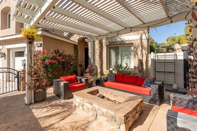 view of patio / terrace featuring fence and an outdoor living space with a fire pit