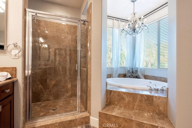 full bathroom with vanity, a bath, a notable chandelier, and a shower stall