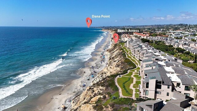 aerial view featuring a beach view and a water view