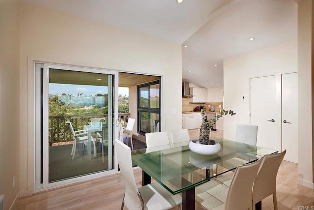 dining room with recessed lighting, baseboards, and light wood-type flooring
