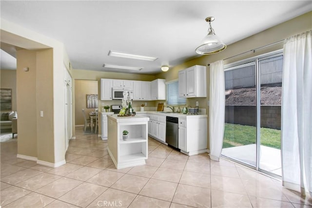 kitchen featuring stainless steel dishwasher, open shelves, white microwave, light countertops, and white cabinets