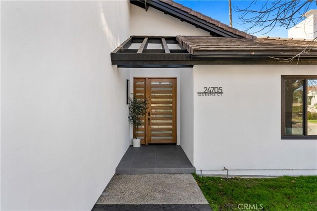 24705 Queens Ct, Laguna Niguel, CA 92677 - entrance to property featuring stucco siding