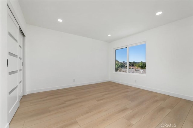 24705 Queens Ct, Laguna Niguel, CA 92677 - spare room with light wood finished floors, recessed lighting, and baseboards