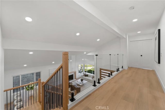 hall with recessed lighting, an upstairs landing, wood finished floors, and vaulted ceiling with beams