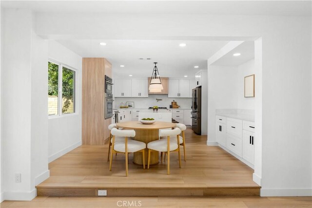 24705 Queens Ct, Laguna Niguel, CA 92677 - dining room with light wood-style floors, recessed lighting, and baseboards