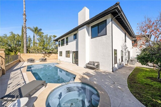 24705 Queens Ct, Laguna Niguel, CA 92677 - view of pool featuring a patio, a fenced backyard, and a pool with connected hot tub