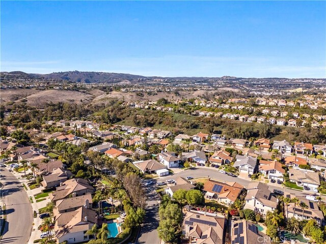 24705 Queens Ct, Laguna Niguel, CA 92677 - aerial overview of property's location with nearby suburban area and a mountain backdrop
