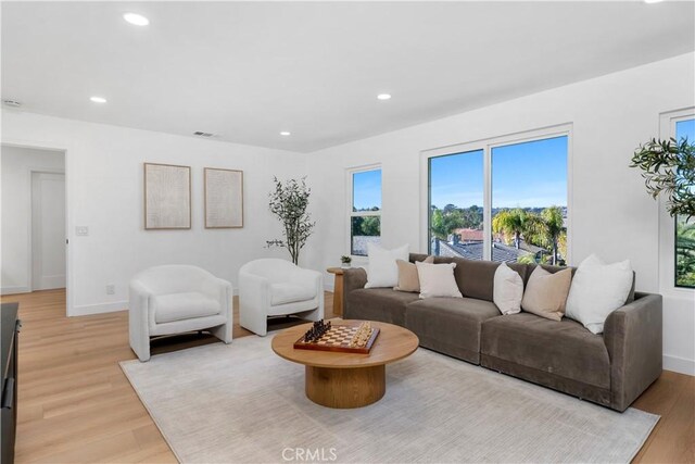 24705 Queens Ct, Laguna Niguel, CA 92677 - living area with light wood finished floors, recessed lighting, and baseboards