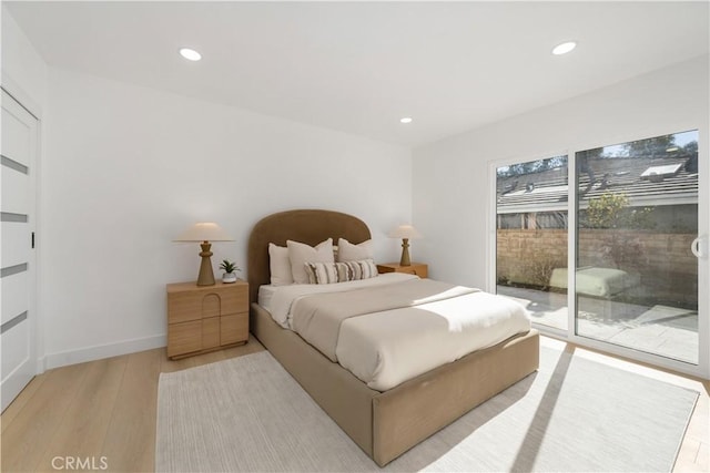 bedroom featuring access to outside, recessed lighting, baseboards, and light wood-type flooring
