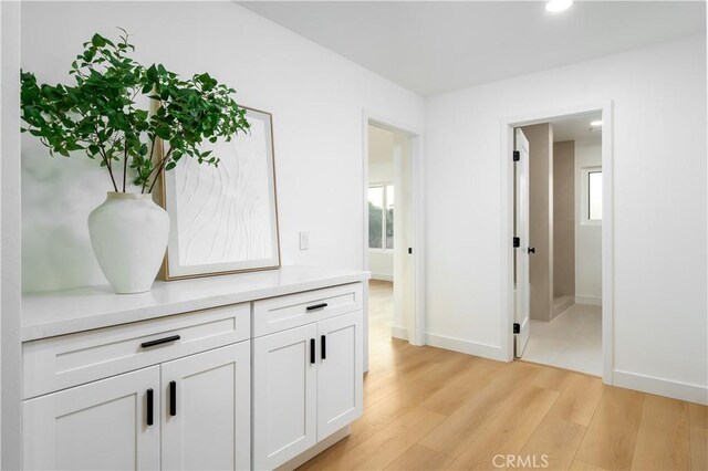 24705 Queens Ct, Laguna Niguel, CA 92677 - hallway with light wood-type flooring, baseboards, recessed lighting, and plenty of natural light