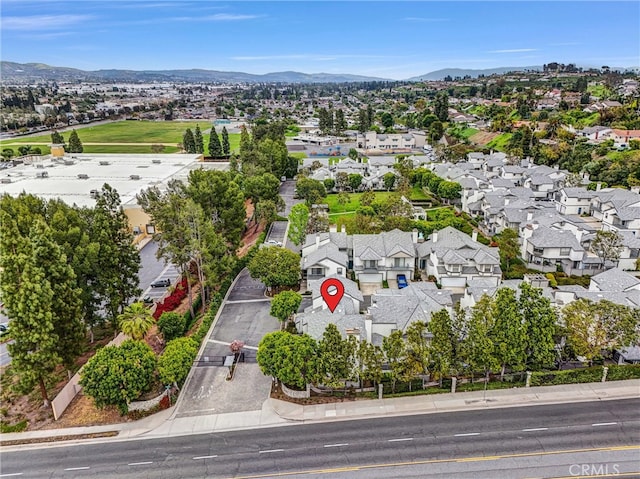 drone / aerial view featuring a residential view and a mountain view