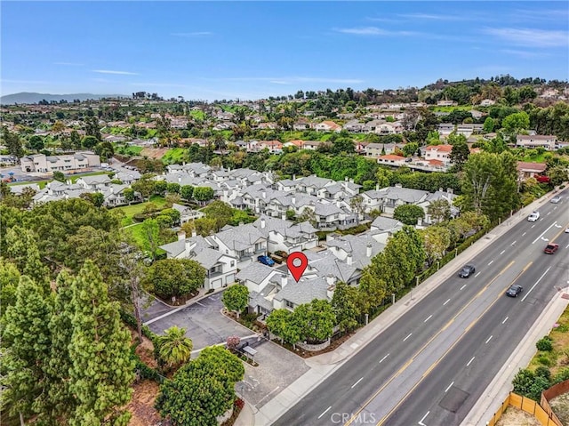 birds eye view of property with a residential view