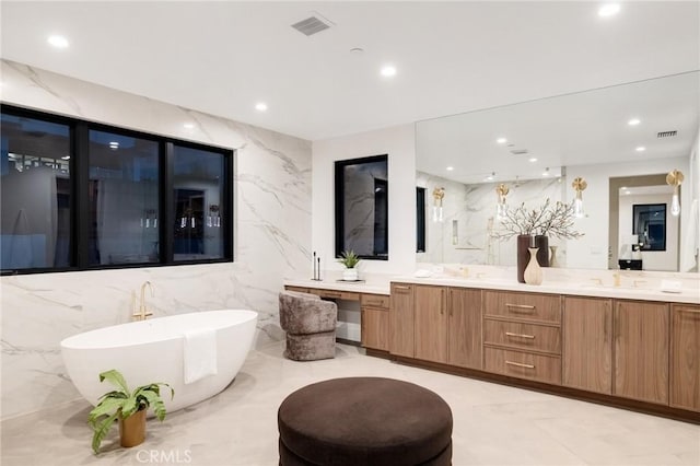 932 9th St, Manhattan Beach, CA 90266 - full bathroom with a freestanding bath, double vanity, recessed lighting, and tile walls