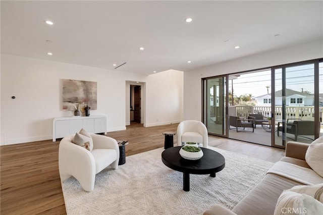 932 9th St, Manhattan Beach, CA 90266 - living room with light wood-style flooring, recessed lighting, and baseboards