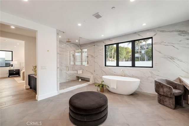 932 9th St, Manhattan Beach, CA 90266 - bathroom featuring a marble finish shower, a soaking tub, and recessed lighting