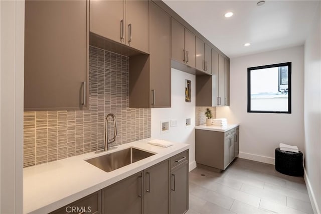 932 9th St, Manhattan Beach, CA 90266 - kitchen featuring a sink, tasteful backsplash, light countertops, baseboards, and recessed lighting