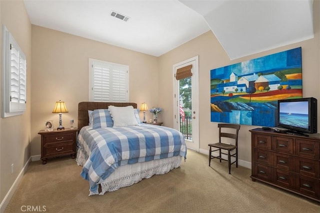 carpeted bedroom featuring baseboards, access to outside, and visible vents