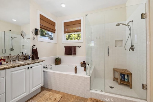 bathroom featuring vanity, tile patterned flooring, a shower stall, and a bath