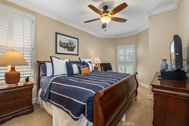 bedroom with crown molding, baseboards, ceiling fan, and light colored carpet