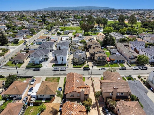 birds eye view of property with a residential view and a mountain view