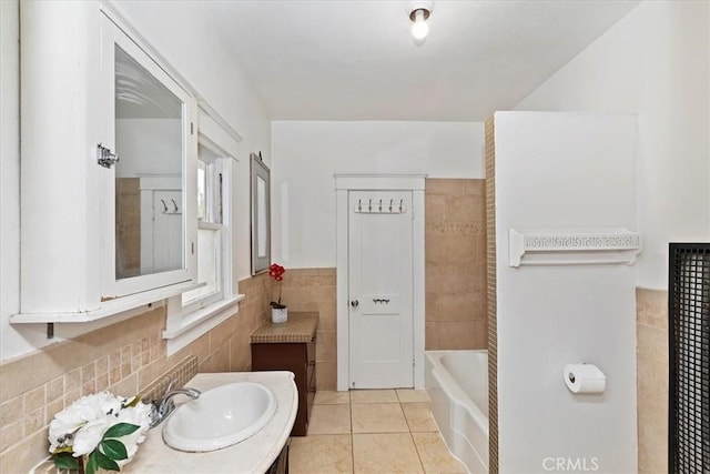 4643 Victoria Ave, Riverside, CA 92507 - full bath with tile walls, vanity, tile patterned floors, and a bath