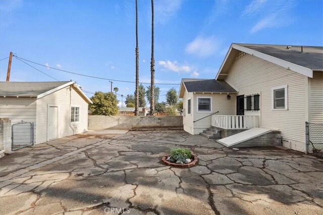 4643 Victoria Ave, Riverside, CA 92507 - back of property with a fenced backyard, a patio area, and a gate