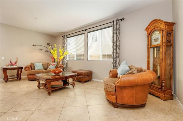 sitting room with light tile patterned flooring and baseboards