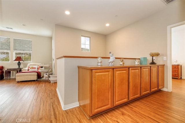 kitchen featuring light wood-style floors, recessed lighting, visible vents, and a wealth of natural light