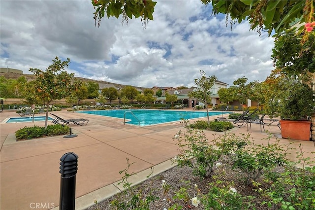 pool featuring a patio area