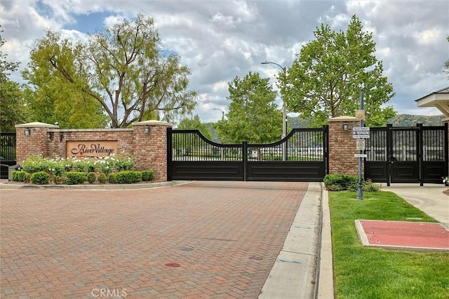 view of gate with fence