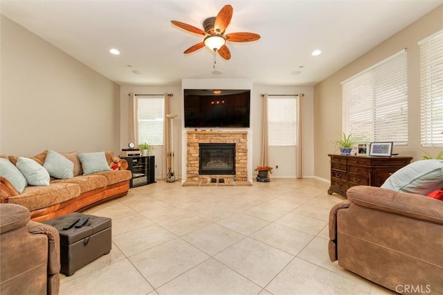 living area featuring recessed lighting, a ceiling fan, light tile patterned flooring, and a fireplace