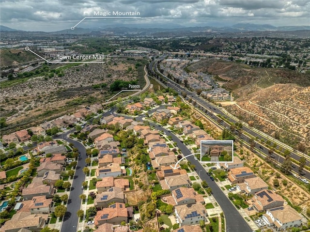 aerial view with a mountain view and a residential view
