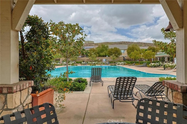pool featuring a patio area