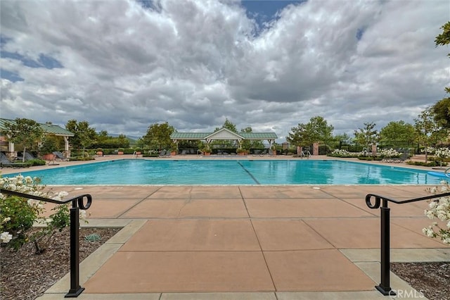 community pool featuring a patio area