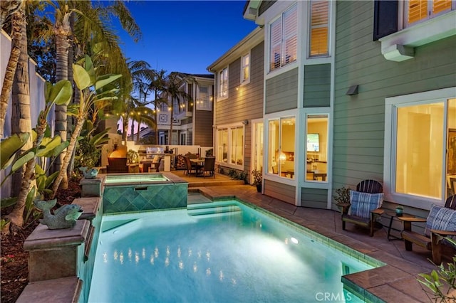 view of pool with a patio, an outdoor hangout area, and a fenced in pool