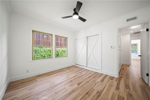 206 Calle De Sirenas, Redondo Beach, CA 90277 - unfurnished bedroom with light wood-type flooring, ornamental molding, baseboards, a closet, and attic access