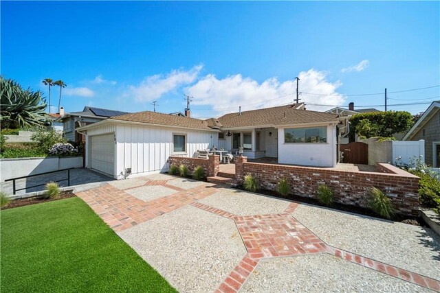 206 Calle De Sirenas, Redondo Beach, CA 90277 - rear view of house featuring board and batten siding, a garage, fence, driveway, and a porch